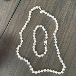 Sterling silver pearl necklace and bracelet set.